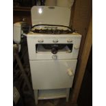 A vintage Newhome Kitchenette freestanding cream enamel two ring gas cooker, together with a further