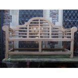 A contemporary teak three seat garden bench in the lutyens style