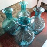 Four oversized turquoise glass floor vases, 73cm high (4)