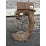 A well detailed carved architectural corbal in the form of a stylised dolphin, 50cm tall approx