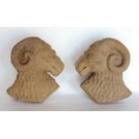 Interesting pair of carved wooden rams heads, 23cm high (2)