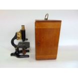 W R Prior & Co of London monocular cast metal and brass microscope in a case fitted with further