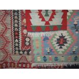 Three small Kelim rugs all with similar typical palette