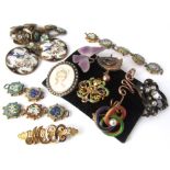 A collection of brooches to include four enamel examples, one modelled as a butterfly. Together with