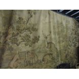 A large machine woven tapestry wall hanging of rectangular form showing deer and further wildlife in
