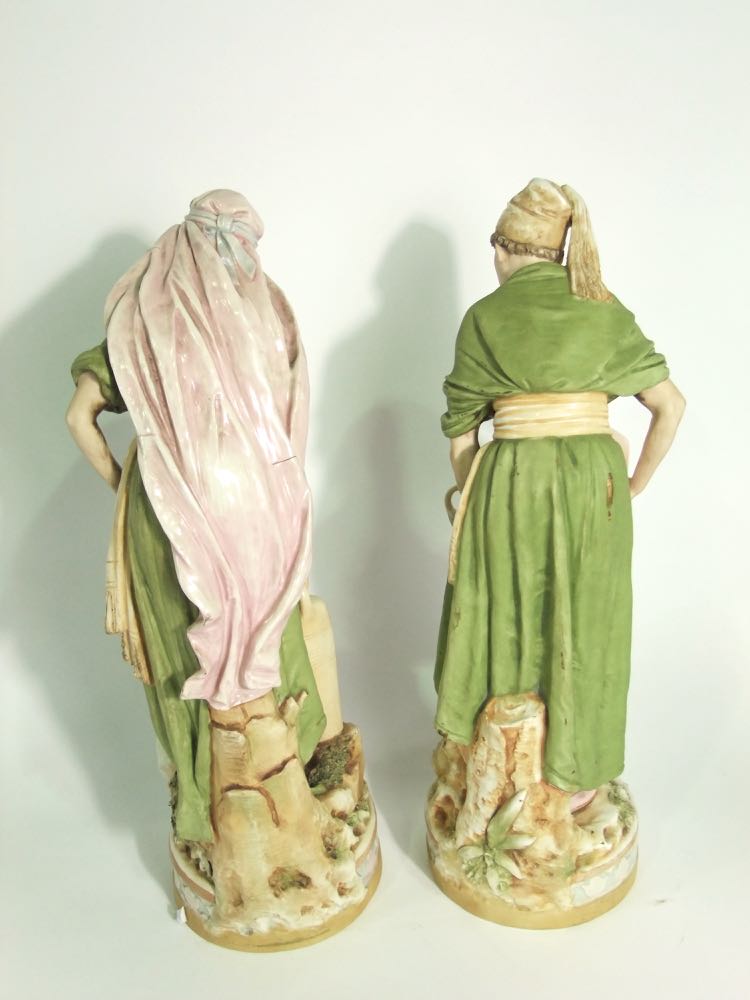 A pair of large early 20th century Royal Dux figures of male and female water carriers, both in - Image 3 of 4