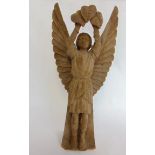 A carved wooden figure of an angel holding aloft leaves, 31 cm high approx.