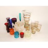 A collection of various art glass to include a lemonade set, amethyst glass goblet, mottled glass