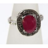 An 18ct white gold pink ruby and diamond ring, size M/N, 4.5g