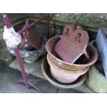 A pair of weathered contemporary composition stone garden urns in the Georgian style with squat