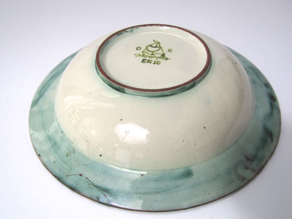 A 19th century Della Robbia dish with painted green strapwork style decoration on a brown ground and - Image 2 of 2
