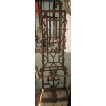 A 19th century cast iron simulated bamboo two divisional hall stand with raised back supporting