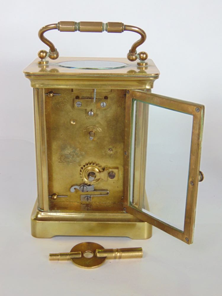 Brass carriage clock in cornice case with enamelled dial, the back plate engraved with a striding - Image 3 of 3