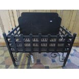 A heavy cast iron fire basket of rectangular form with trellis frieze and simple scrollwork detail