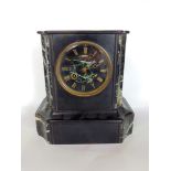 A 19th century black slate mantle clock with 10cm two train dial