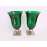 A good pair of green glass and silver plated vases, with flared rims upon an ovoid silver plated