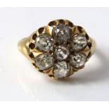 An early Victorian yellow metal ring set with seven large diamonds size E, 5g