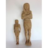 A carved wooden pharaoh, 48cm high together with a smaller example, 31cm high (2)