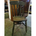 12 Windsor elm and beechwood kitchen chairs all with shaped and pierced central splats raised on