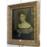 An early 20th century oil painting on canvas, bust length portrait of a woman with upswept hair,