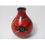 A Poole Pottery red ground vase of ovoid form with drawn neck and with stylised poppy decoration,