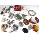 An interesting collection of costume jewellery including a silver amethyst pendant and brooch, a