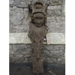 A well detailed carved architectural wooden corbel with female face mask, scrolling acanthus,