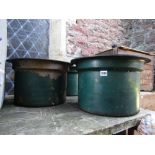 Three heavy cast iron tubs/planters of squat cylindrical form with pronounced rims and green painted