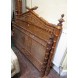 An unusual 19th century bedstead in birds eye maple, framed in simulated bamboo borders complete
