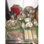 A mixed lot of silver plate to include a four piece boat shaped tea service, wine cooler, entree