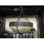 A reproduction ceiling lantern of circular form with pierced framework and simulated marbled glass