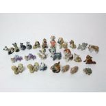 A collection of Wades Walt Disney and other figures including characters from Lady and the Tramp