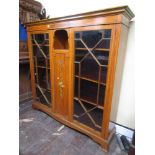 A high quality Edwardian satinwood display cabinet, the central door with painted detail showing