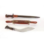 A mixed lot of daggers to include a Khukri, a bayonet sword and sheath and an eastern carving set (