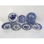 A pair of early 19th century blue and white printed plates showing Eastern scenes including a