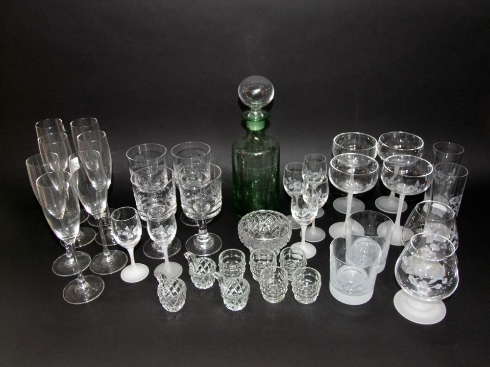 A mixed collection of glass ware to include various etched glasses, rummers, champagnes, etc and