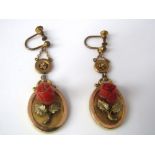 A pair of Victorian yellow metal earrings, with carved coral roses and screw fittings, 6g