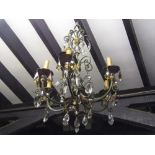 A pair of good quality six branch chandeliers with scrolled branches, partially gilded finish and