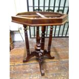 A hardwood occasional table base raised on four turned supports, under gallery supported on a