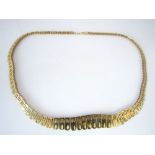 A 9ct gold Cleopatra style necklace, 18.5g