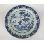 Qing Dynasty Chinese blue and white painted charger, the central panel showing a standing male