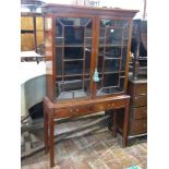 A good quality Georgian style mahogany bookcase or side cabinet, with dentil moulded frieze over a