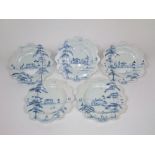 A set of five Isis studio pottery plates with painted blue and white decoration of pastoral scenes