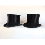 Two similar brushed silk top hats.