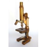 An Ernst Leitz brass lacquered microscope.