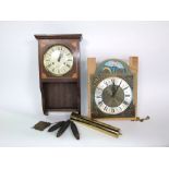 A collection of horology to include an incomplete eight bell long case dial, a further wall clock