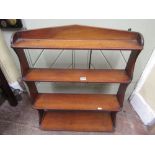 A 19th century mahogany, wall mounted flight of four graduated book shelves within a shaped