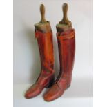 A pair of gentleman's riding boots with zipper front fastening, with wooden boots tree by Maxwell