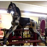 A rocking horse on central rail with restored finish, 110 cm in length, 110 cm high