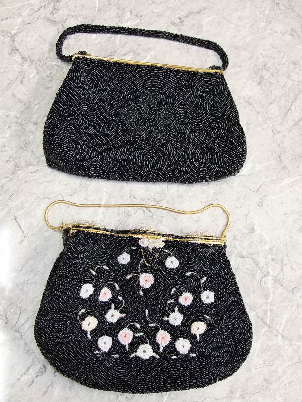 Two French beadwork evening bags in black. One with coloured floral detail